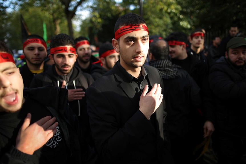 Shia Muslims take part in an Ashura day mourning procession on November 14, 2013 in London, England.