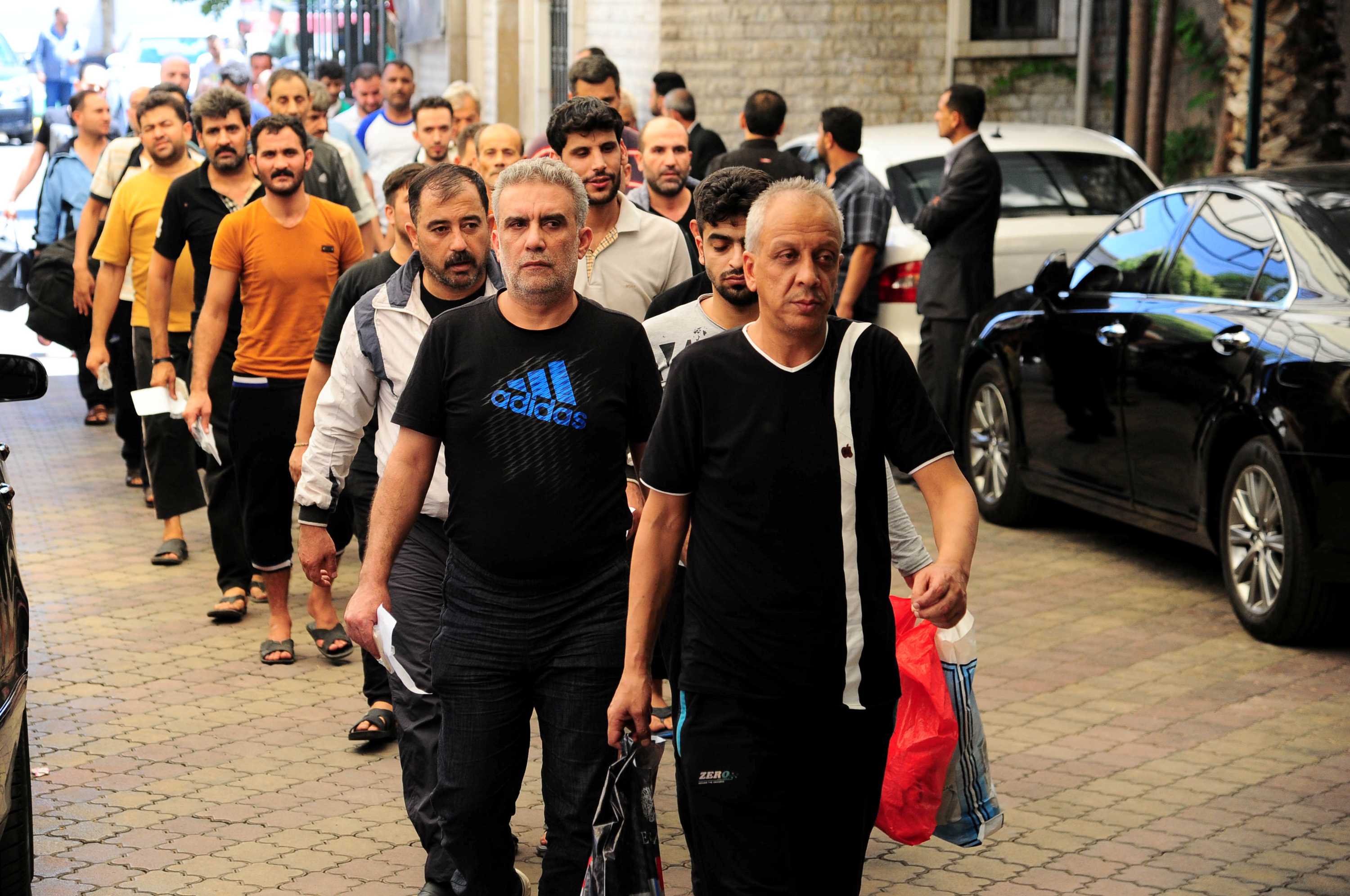 Opposing sides of the Syrian conflict release hundreds of prisoners at ...