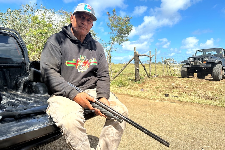 A man holding a rifle