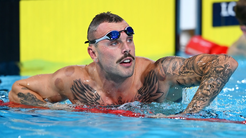 Kyle Chalmers leans on the lane ropes