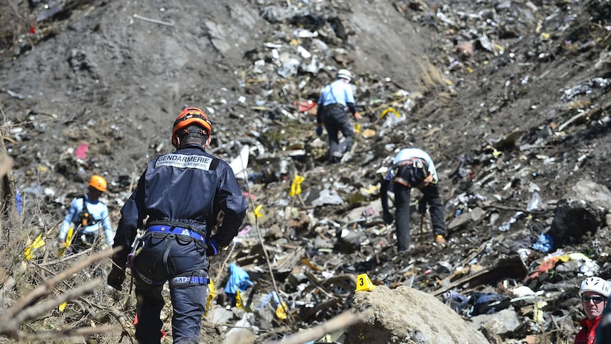 A Gendarme works at the Germanwings crash site