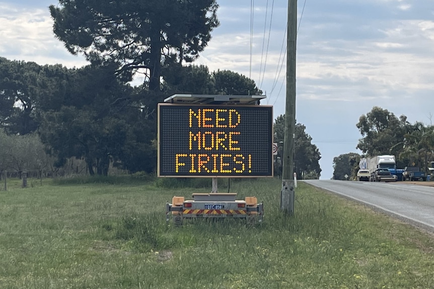 A sign on the way to Gibson called for more fire fighters.