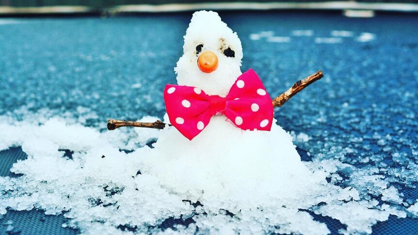 Small snowman with red bow tie