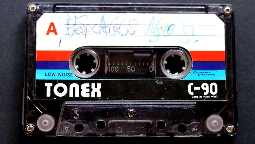 An image of a Tonex cassette tape recorded by Justin Heazlewood as a child, titled 'Us Ages Ago'.