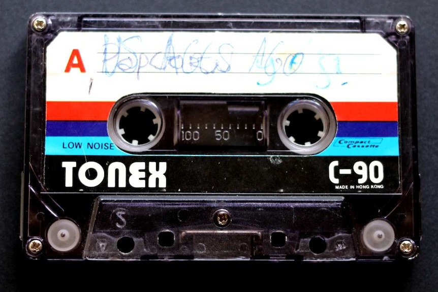 An image of a Tonex cassette tape recorded by Justin Heazlewood as a child, titled 'Us Ages Ago'.