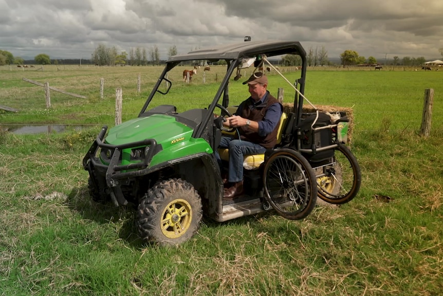 Photo of a man on a tractor.