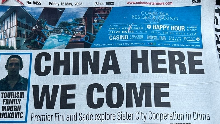 The front page of Solomon Star newspaper shows a large headline reading "CHINA HERE WE COME".