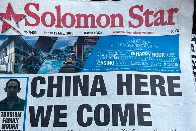 The front page of Solomon Star newspaper shows a large headline reading "CHINA HERE WE COME".