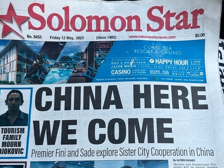 The front page of Solomon Star newspaper shows a large headline reading "CHINA HERE WE COME".