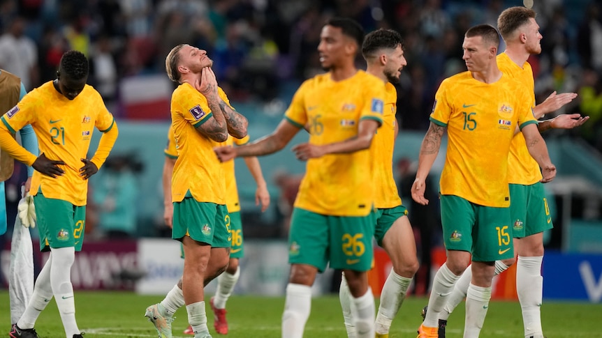 Dejected Socceroos after their loss to France