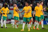 Dejected Socceroos after their loss to France