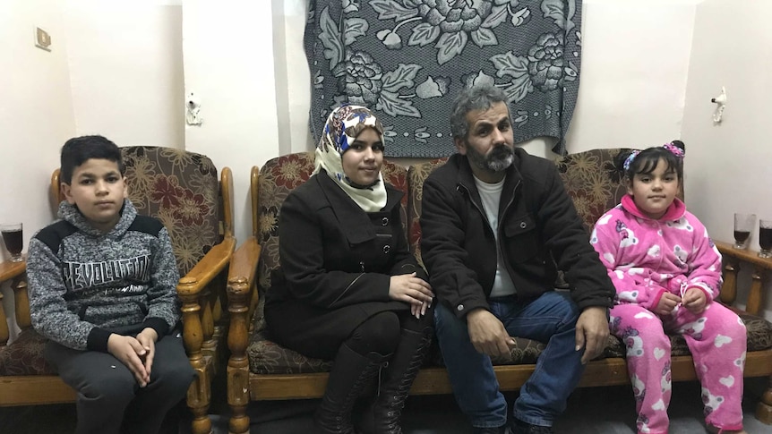 Saeed Tabaza, a third generation Palestinian refugee, with his family.