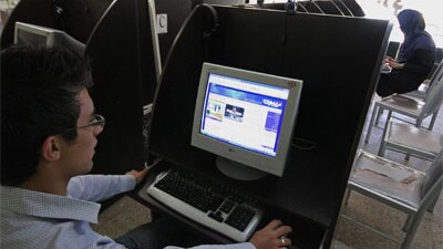 An Iranian youth browses a political blog at an internet cafe on May 27, 2009