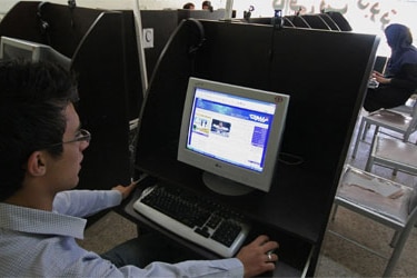 An Iranian youth browses a political blog at an internet cafe on May 27, 2009