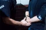 Man handcuffed by police