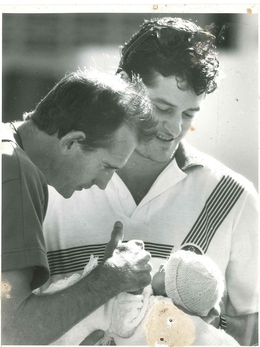 Football coach Wayne Bennett with Peter Jackson and one of his children