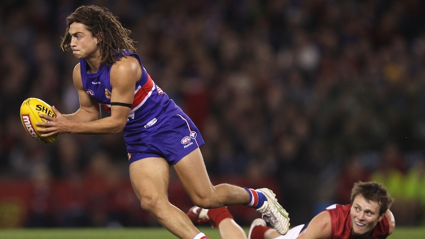 Luke Dauhlhaus running with the ball for the Western Bulldogs