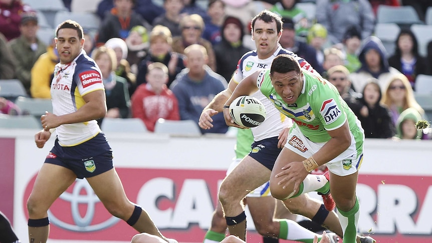 Josh Papalii breaks through the Cowboys defence to score.