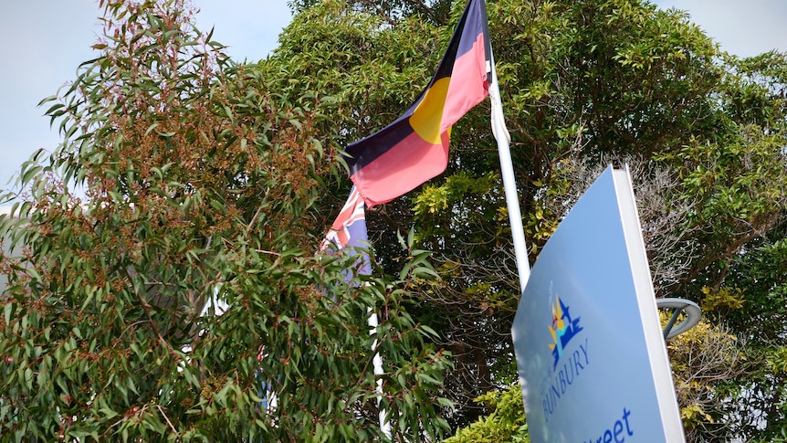 A photo of the Indigenous flag outside a council building.