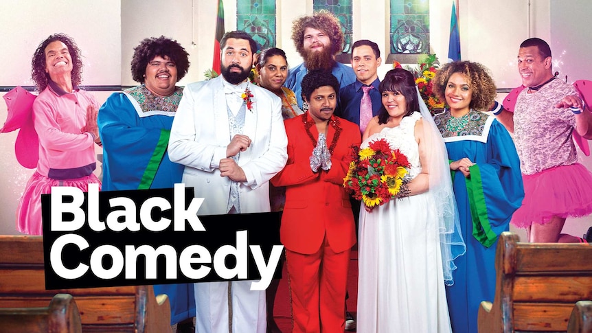 Black Comedy cast standing in the walkway of a church surrounded by pews