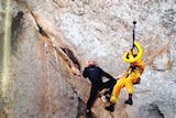 The man looking terrified as he is rescued from Morro Rock.