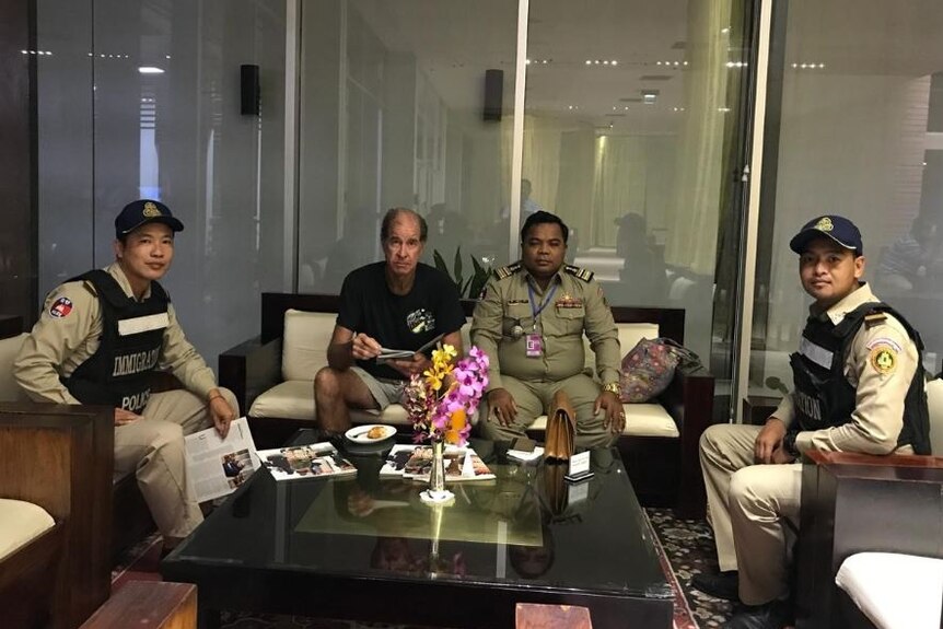 James Ricketson with Immigration Police in Cambodia
