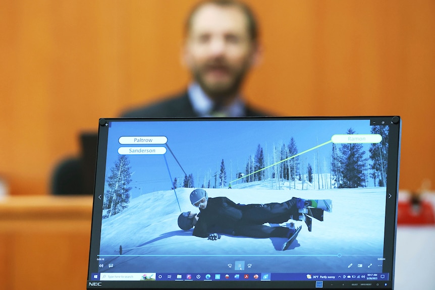 A screen shows an animation of a collision between two skiers.