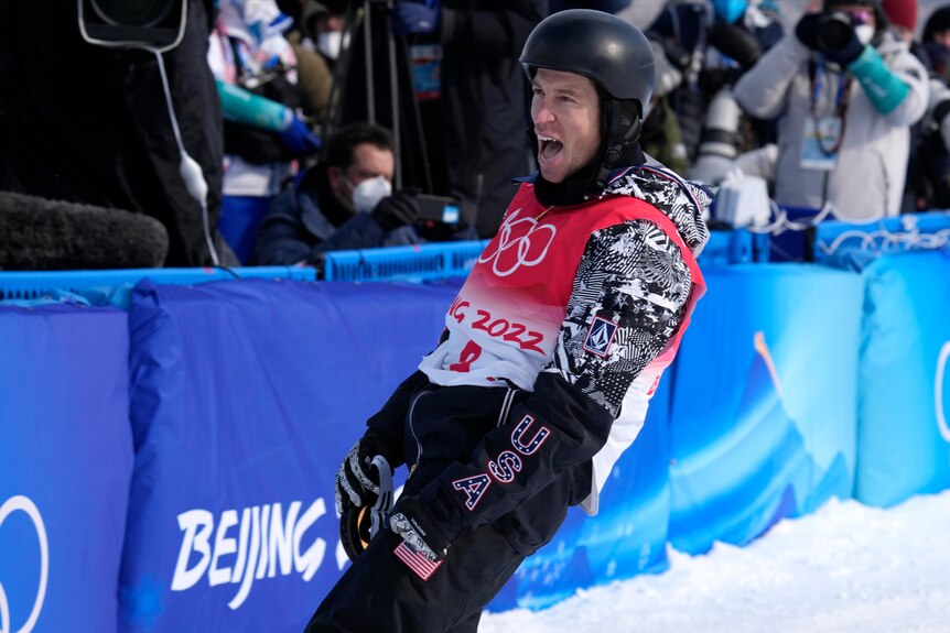 Snowboard superstar Shaun White lets out a shout of joy as he slows down at the end of his 