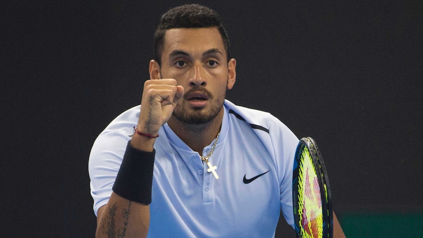 Nick Kyrgios pumps his fist.