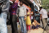 Indians line up to exchange their currency.