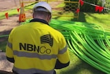 An NBN Co installer with fibre cable