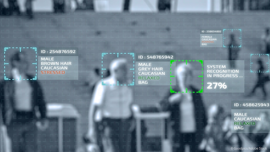 A picture of a screen using biometric surveillance on an elderly couple walking in a public space.