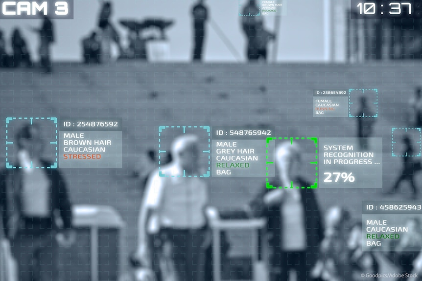 A picture of a screen using biometric surveillance on an elderly couple walking in a public space.