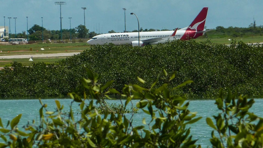A Qantas passenger jet taxis at Broome airport.