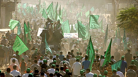 Tens of thousands of Hamas supporters attend a rally in support of the Government.