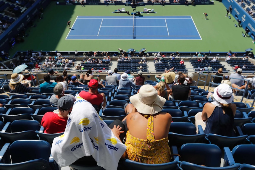 Fans watch the match between Caroline Wozniacki and Samantha Stosur at the US Open in New York.