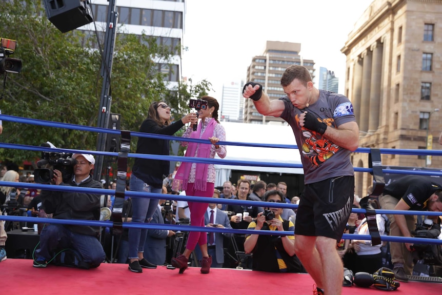 Jeff Horn shadow boxes in the Brisbane CBD
