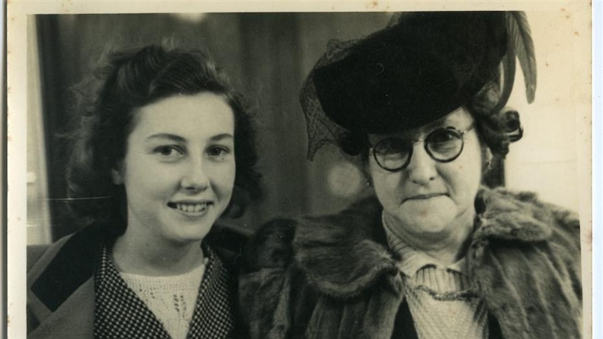 A mother and daughter pose for a photograph from a collection depicting Sydney around the time of the Second World War.