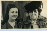 A mother and daughter pose for a photograph from a collection depicting Sydney around the time of the Second World War.