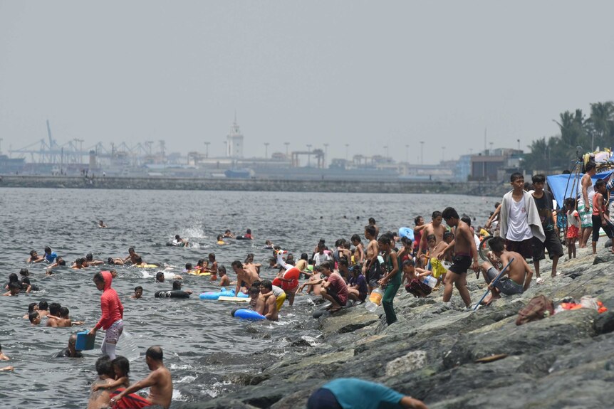 Filipinos swim in Manila bay to mark Easter Sunday.