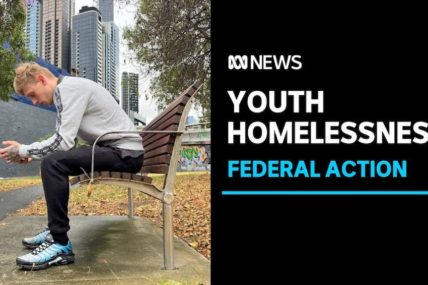 Youth Homelessness, Federal Action: A young man sits on a park bench looking at his hands.