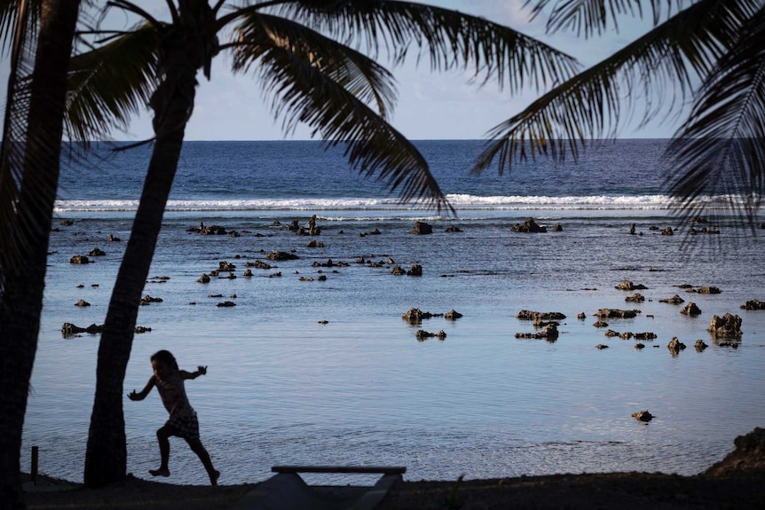 A child plays near the beach in Nauru during the Pacific Islands Forum.