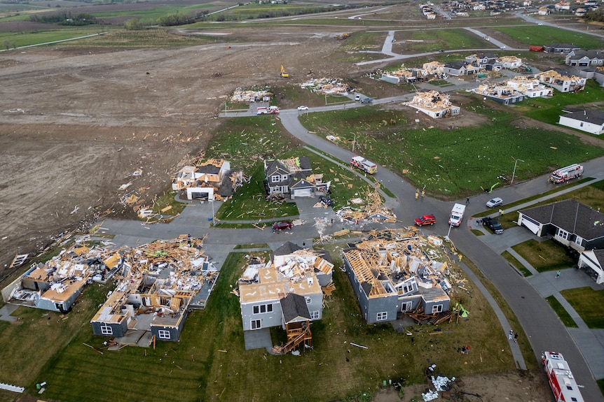 Birds eye view of houses with missing roofs. 