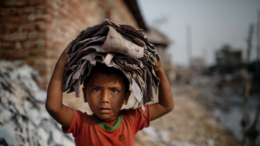 Young boy working in a leather tannery in Bangladesh