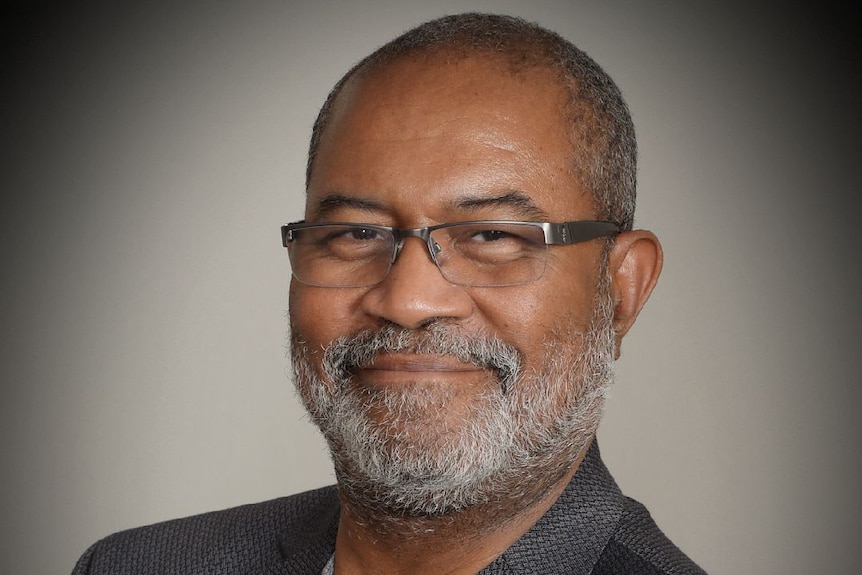 Retired police officer Ron Stallworth smiles for a photo.