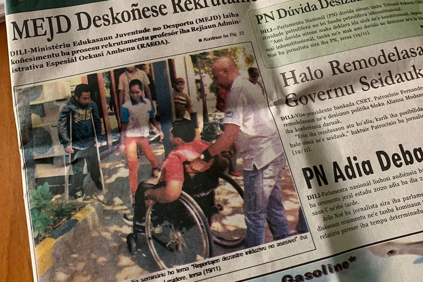 The Timor Post front page featuring an article about the workshop and photo of a person in a wheelchair and another on crutches