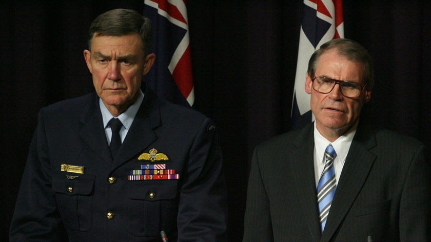 Defence Force Chief Air Chief Marshal Angus Houston (L) and Defence Minister John Faulkner