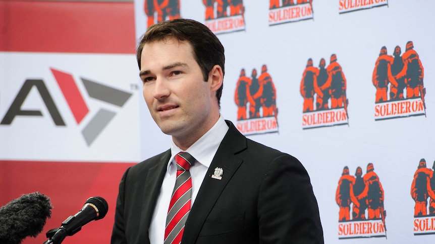 Man standing in front of a microphone