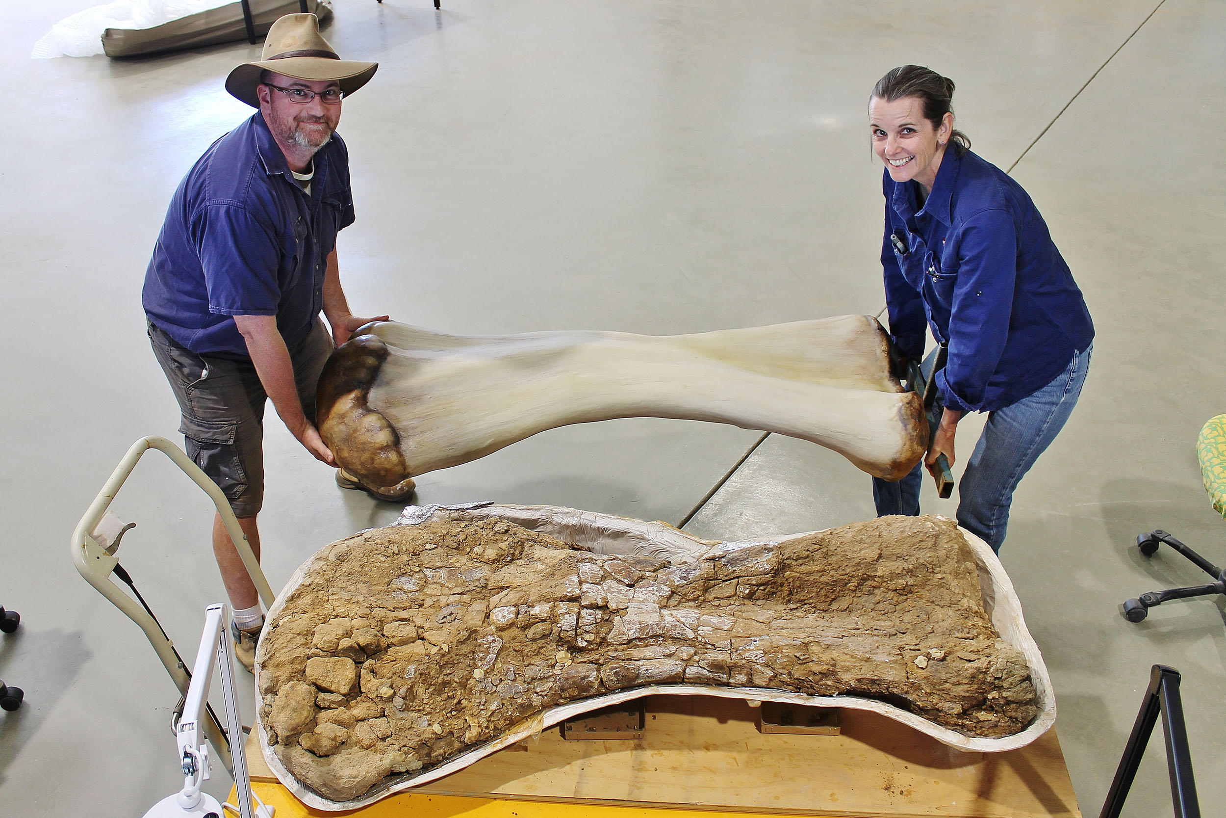 Scott Hocknull and Robyn Mackenzie holding Cooper's humerus bone