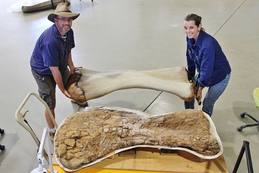 Scott Hocknull and Robyn Mackenzie holding Cooper's humerus bone